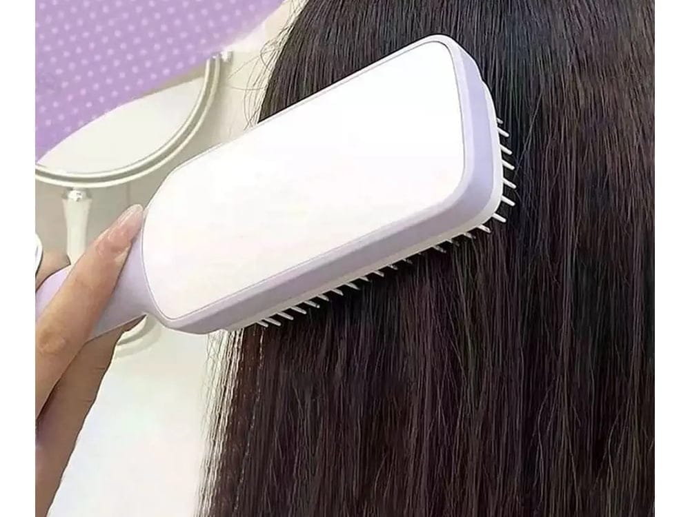Antistatic self-cleaning hair detangling brush
