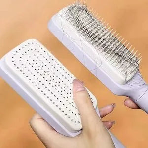 Antistatic self-cleaning hair detangling brush